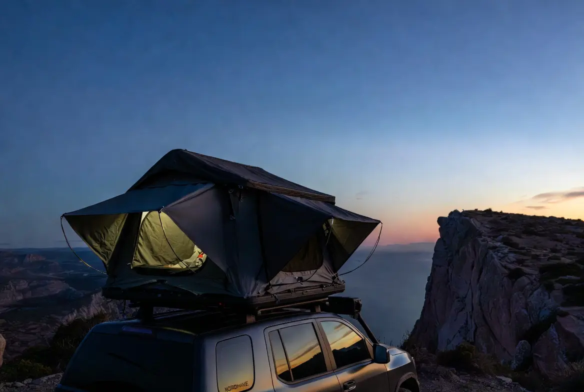 Hard-shell rooftop tent on a clifftop